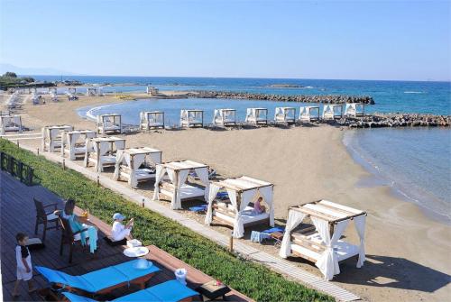 48 фото отеля Knossos Beach Bungalows & Suites 4* 