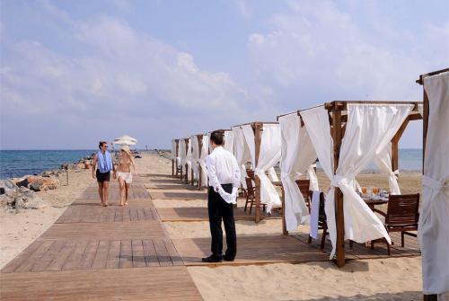 54 фото отеля Knossos Beach Bungalows & Suites 4* 